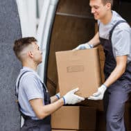 Image of men moving boxes in a van